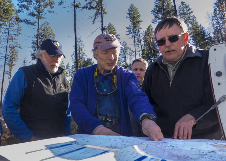 Wildsight's John Bergenske and Juri Peepre, as well as Paul Frasca, RPF, go over a cut block map with Ken Streloff, RFT on a Forestry Field Trip with Canfor to Horsethief drainage. 